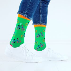 close up of person wearing green socks with bicycle pattern